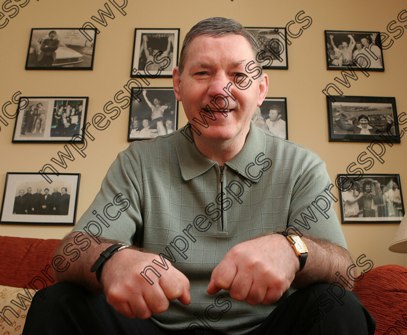 CHARLIE NASH 2 
 Charlie Nash surrounded by photographs of his boxing past at his home in Derry.