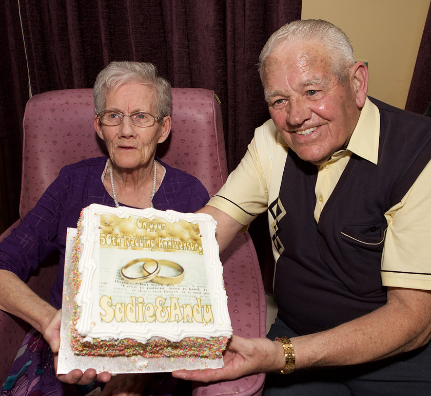 IMG 6075 
 Andy and Sadie with a cake to mark their 50th wedding.